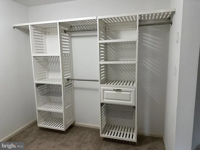 a room with a walk in closet and a window