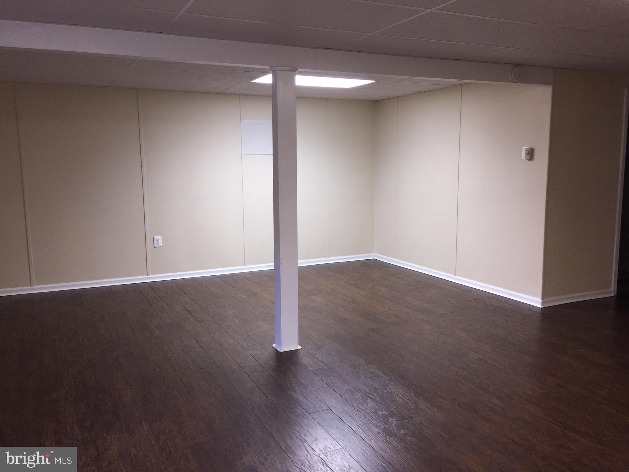 5128 Barness Court Doylestown, PA 18902 - Photo 25 of 27 an empty room with wooden floor