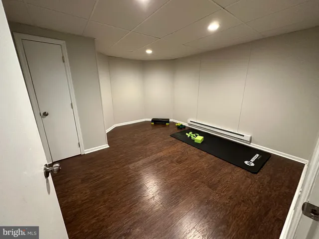 an empty room with wooden floor