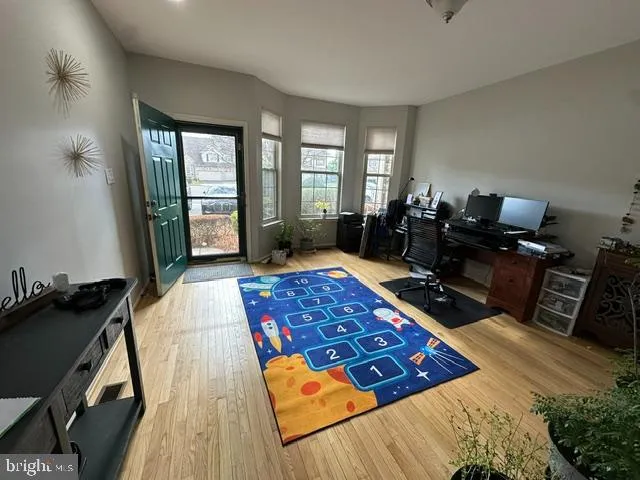 a bed sitting in a room next to a window