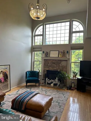 a bedroom with furniture and a fireplace