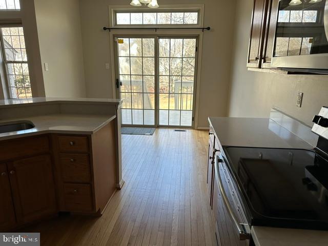 5128 Barness Court Doylestown, PA 18902 - Photo 9 of 27 a kitchen with a wooden floor and a window