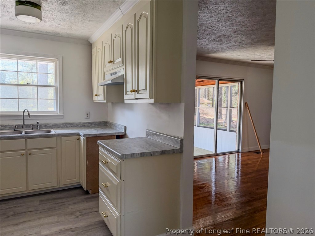 598 Forest Road Lumberton, NC 28358 - Photo 7 of 25 a kitchen with stainless steel appliances granite countertop a sink stove and cabinets