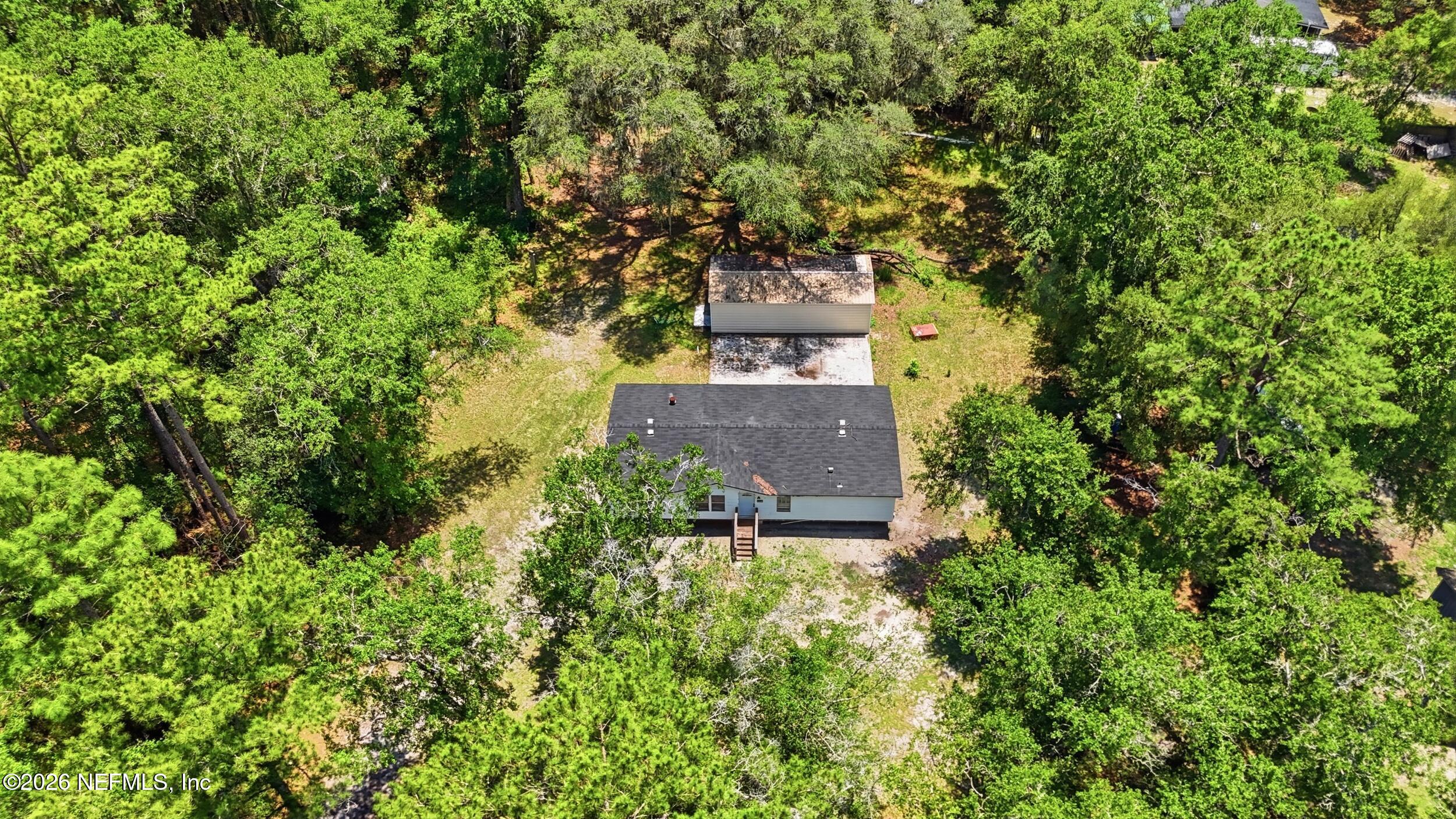5667 Long Branch Cemetery Road Jacksonville, FL 32234 - Photo 24 of 24 an aerial view of a house with a yard