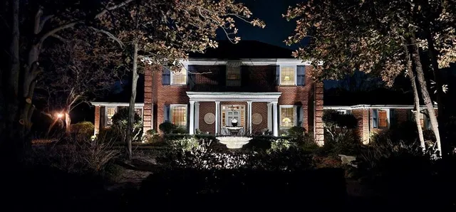 a garden view with a lake