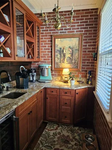 a kitchen with stainless steel appliances granite countertop a stove and cabinets