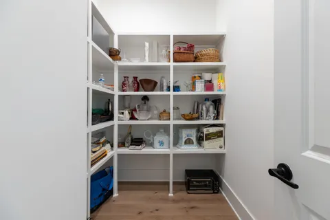a room with a book shelf and a shelf