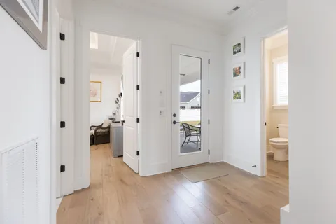 wooden floor with white walls