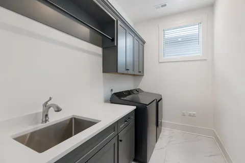 a view of a kitchen with sink and dishwasher