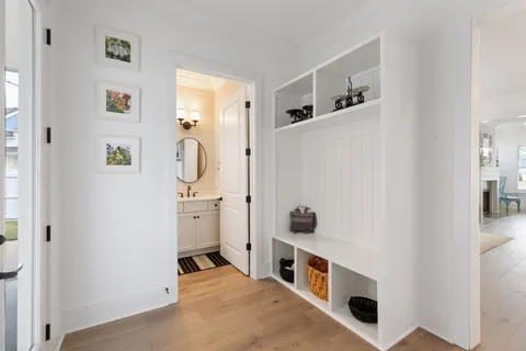 a room with a white cabinets and white appliances