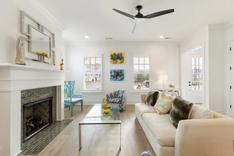 a living room with furniture and a fireplace