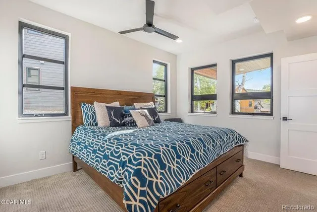 a bedroom with a bed and window