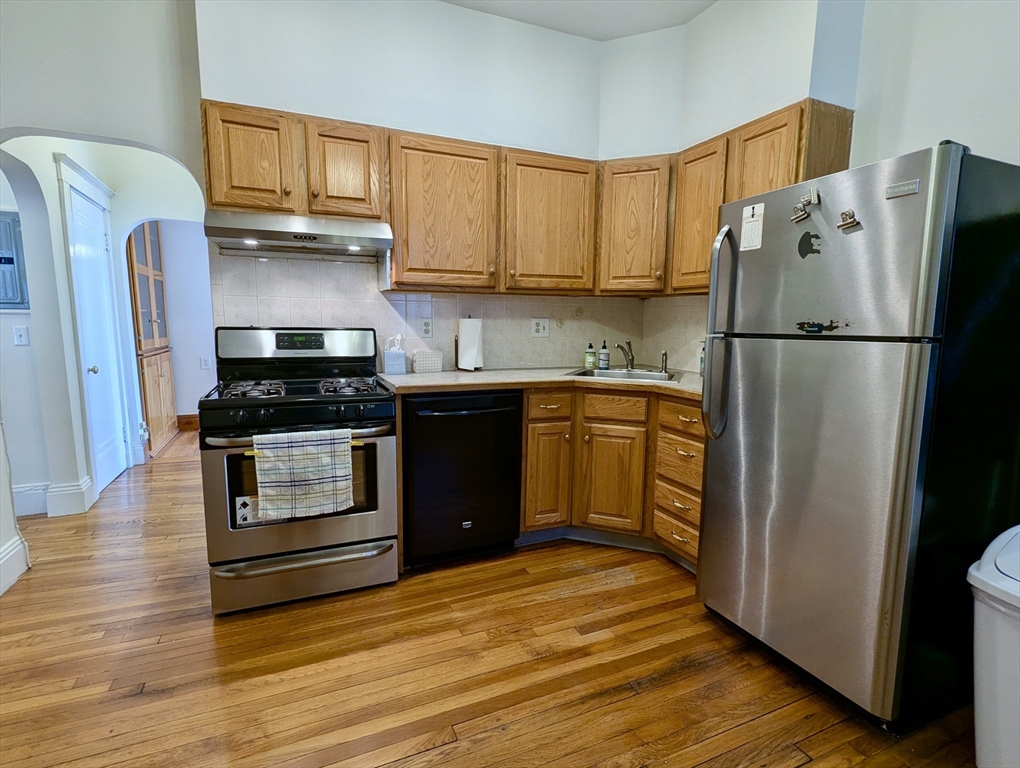 21 Westbourne Terrace, Unit 3 Brookline, MA 02446 - Photo 14 of 23 a kitchen with stainless steel appliances a refrigerator stove and sink