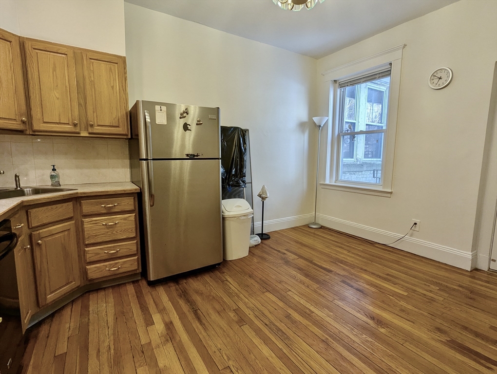 21 Westbourne Terrace, Unit 3 Brookline, MA 02446 - Photo 16 of 23 a kitchen with stainless steel appliances granite countertop a refrigerator and a stove top oven