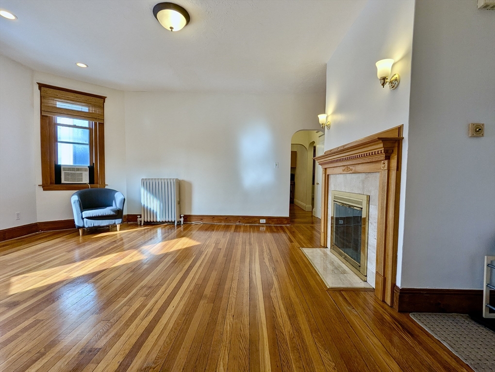 21 Westbourne Terrace, Unit 3 Brookline, MA 02446 - Photo 4 of 23 a view of a livingroom with wooden floor and furniture