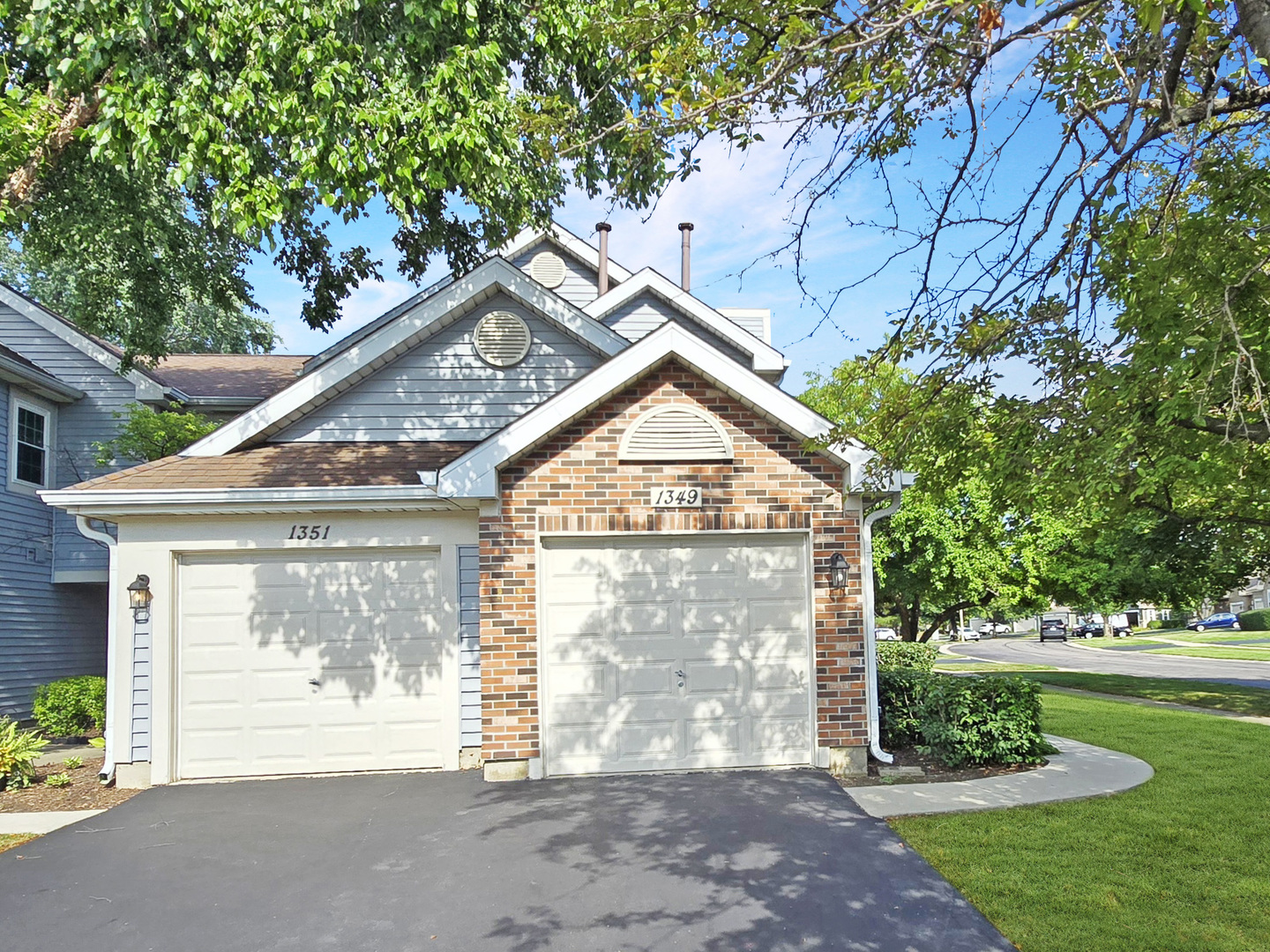 a view of a house with a large tree