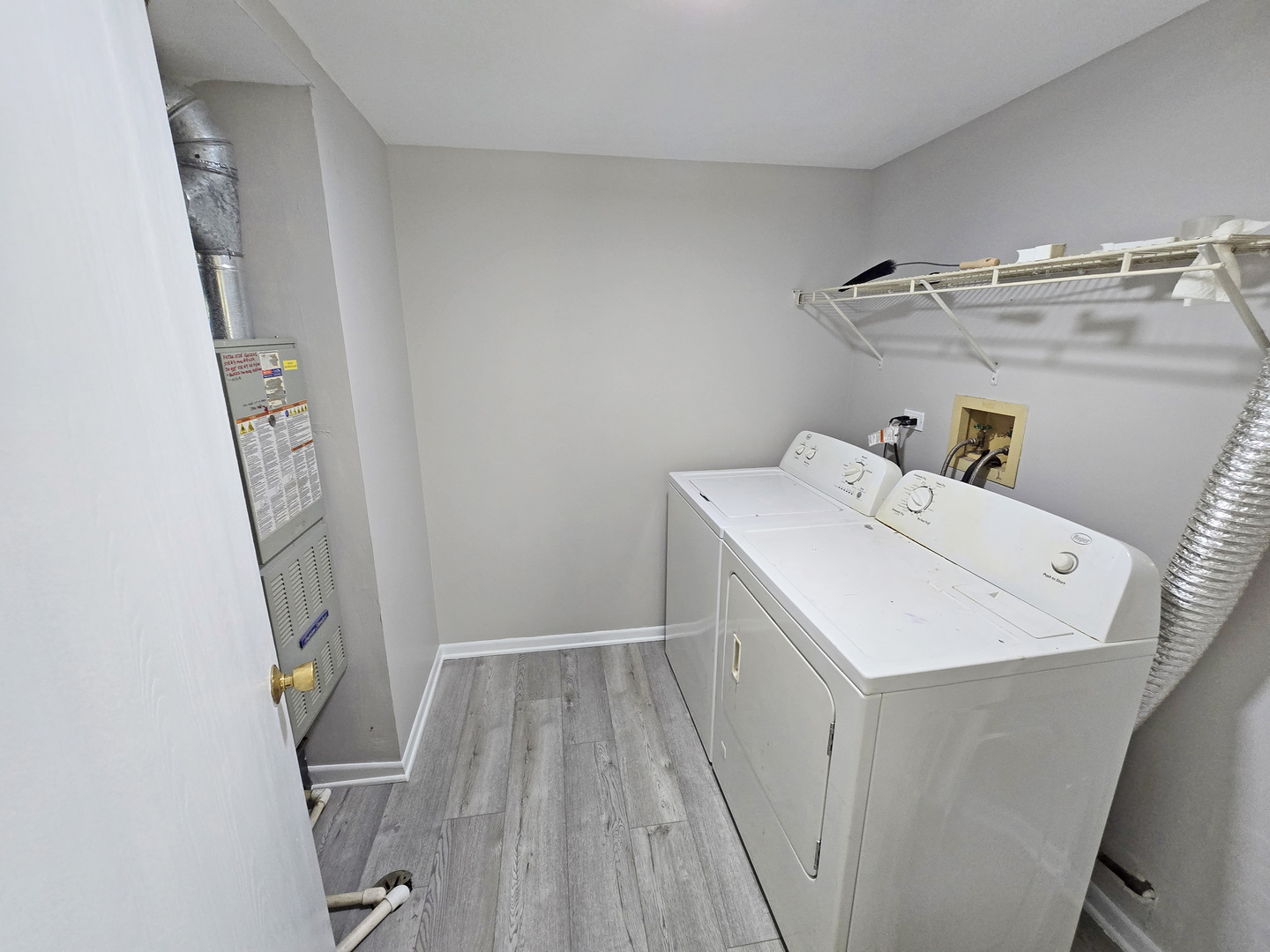 1349 Ridgefield Circle, Unit 1349 Carol Stream, IL 60188 - Photo 8 of 9 a utility room with dryer and washer