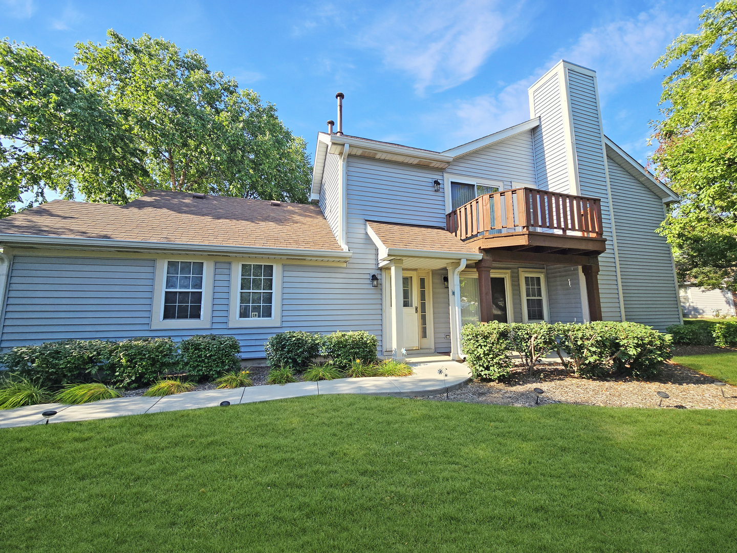 1349 Ridgefield Circle, Unit 1349 Carol Stream, IL 60188 - Photo 9 of 9 a front view of a house with a yard