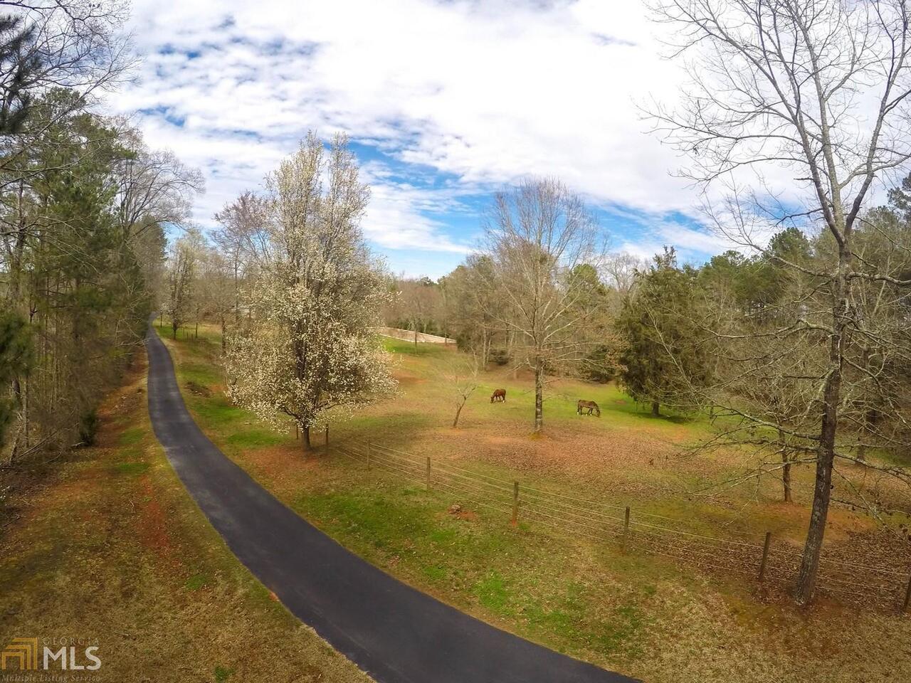 700 Covered Bridge Road Covington, GA 30016 - Photo 1 of 1 a view of a yard with an outdoor seating