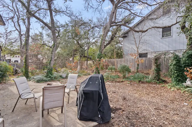a view of a chairs and tables in the backyard