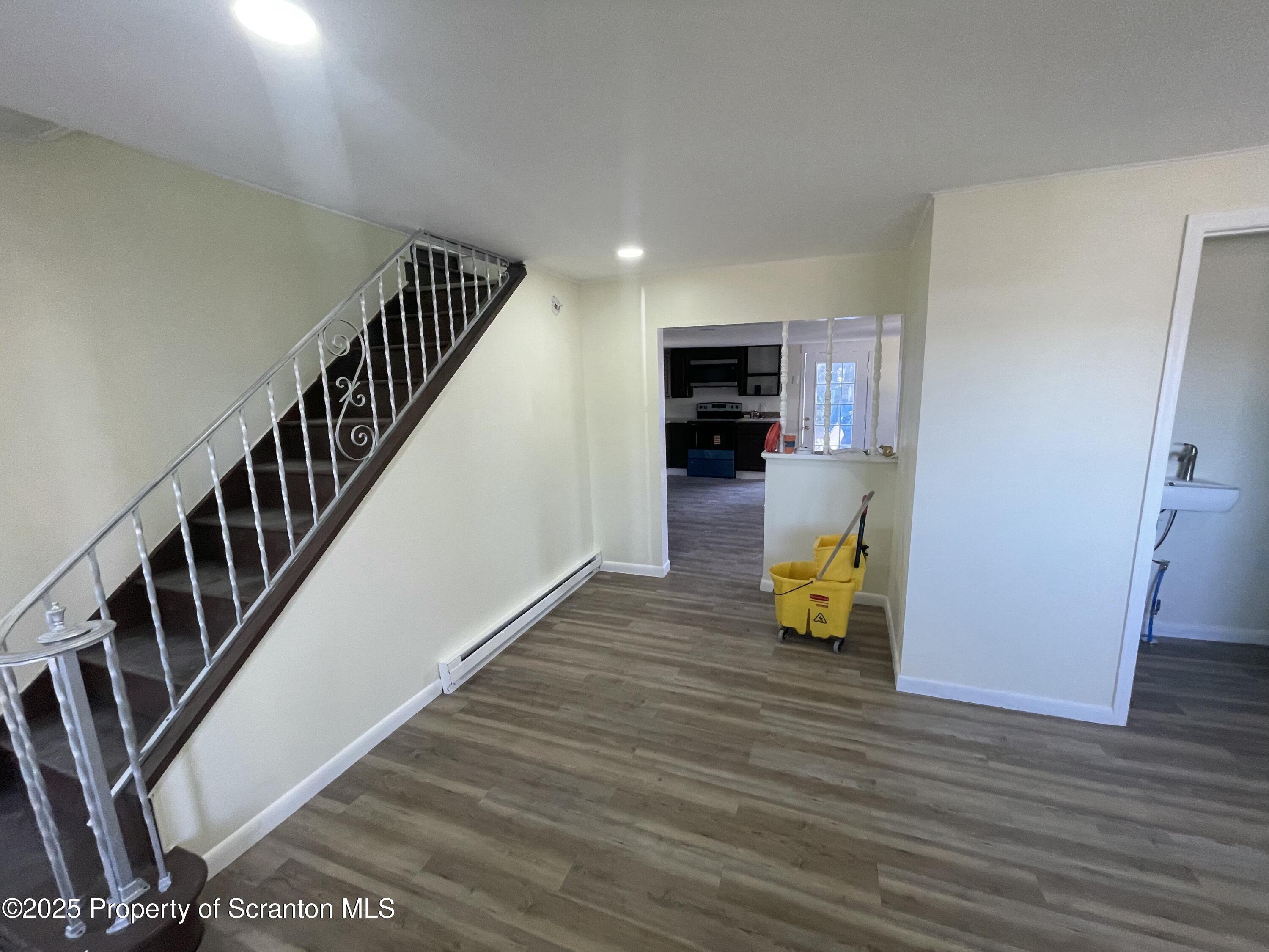 116 Wright Street Duryea, PA 18642 - Photo 2 of 14 a view of entryway and hall with wooden floor