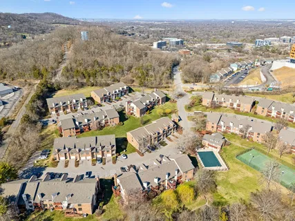 an aerial view of residential building and parking space