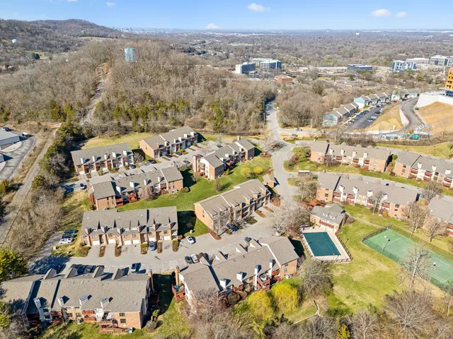 an aerial view of residential building and parking space