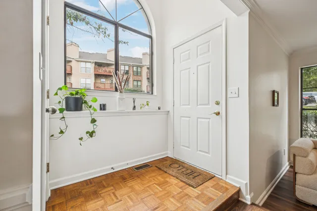 a view of kitchen with furniture and wooden floor