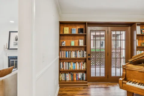 a view of a livingroom with furniture and staircase