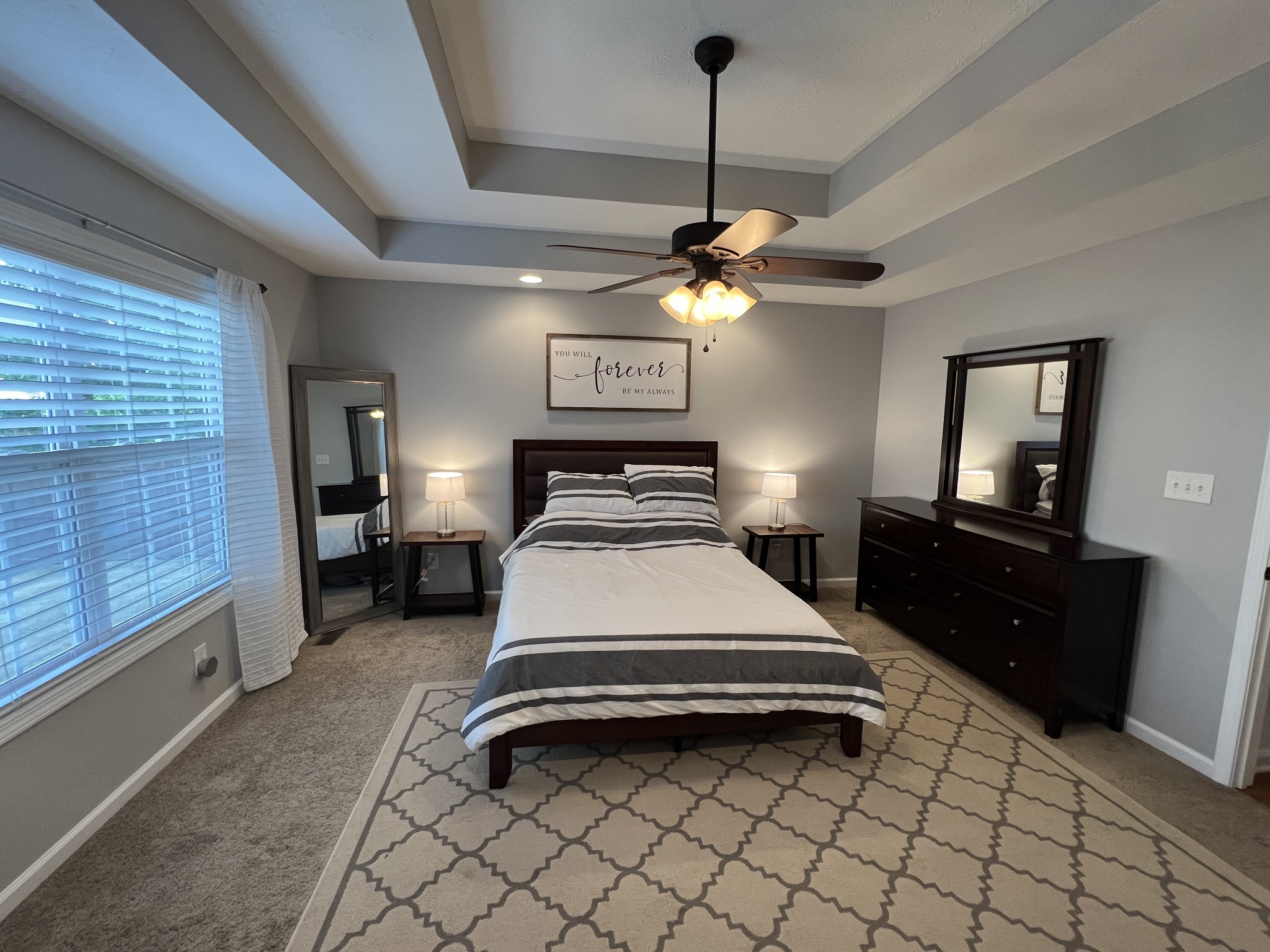 3785 Suiter Road Clarksville, TN 37040 - Photo 11 of 21 a bedroom with a bed and a chandelier