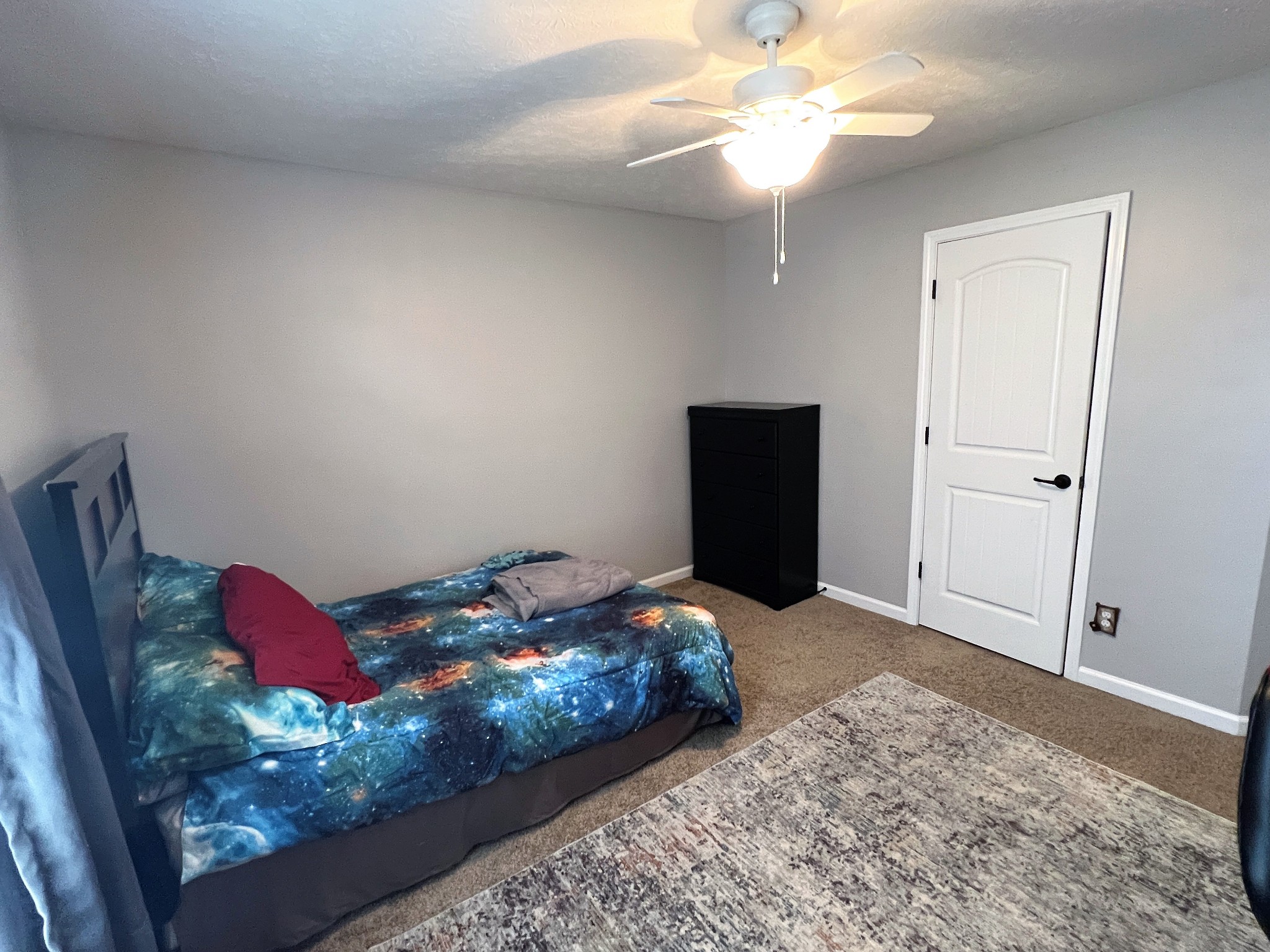 3785 Suiter Road Clarksville, TN 37040 - Photo 15 of 21 a bedroom with a bed and a chandelier