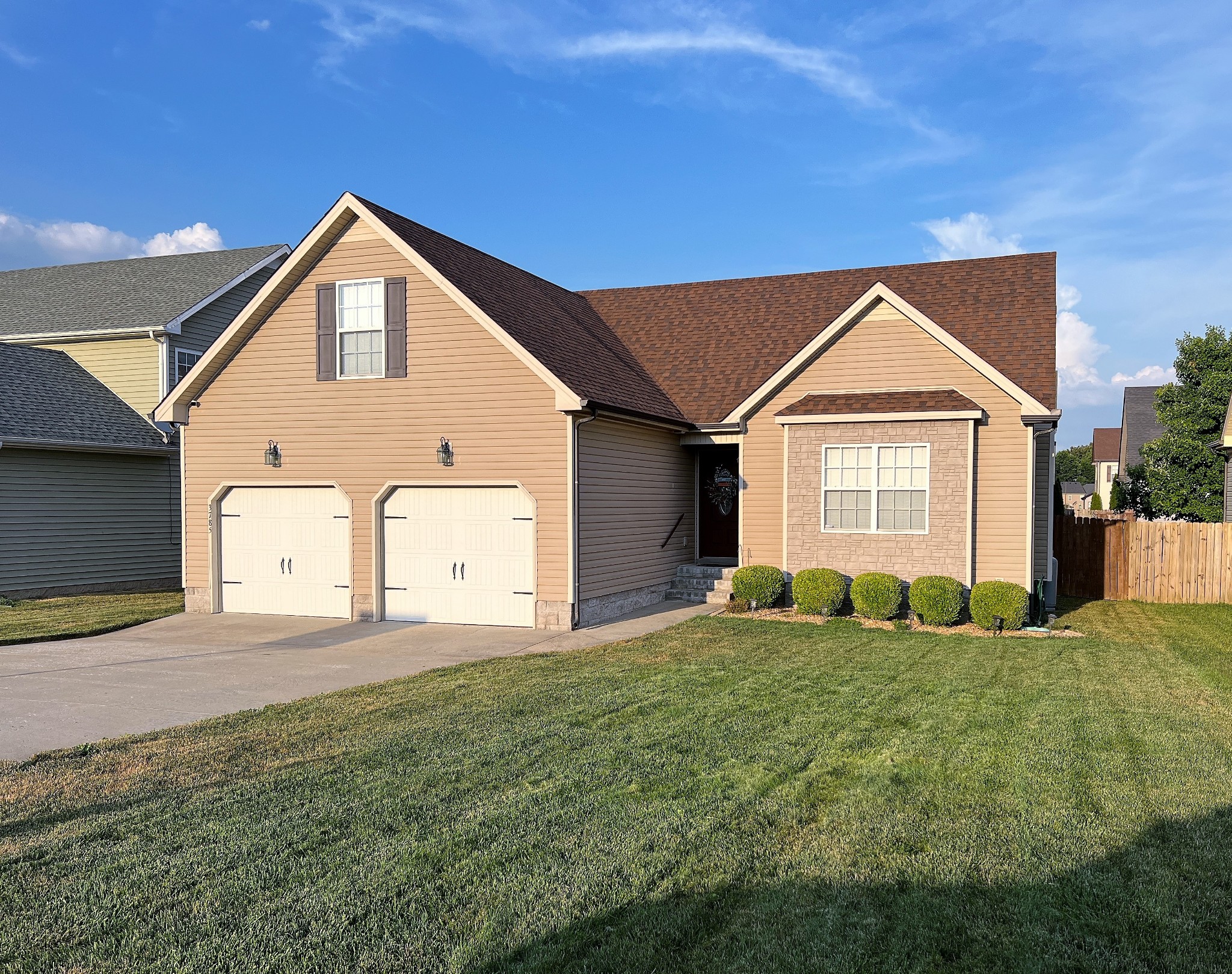 3785 Suiter Road Clarksville, TN 37040 - Photo 2 of 21 a front view of a house with a yard and garage