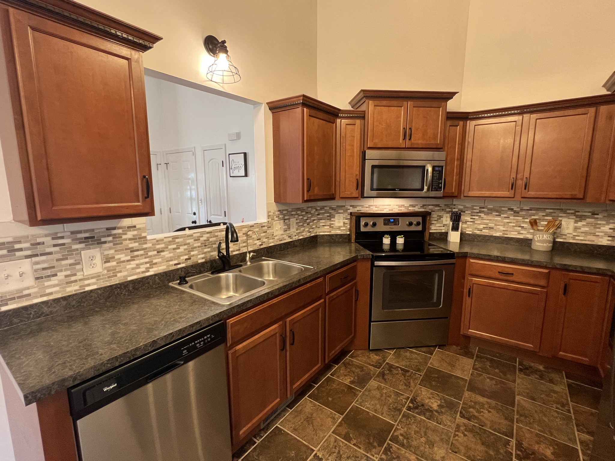 3785 Suiter Road Clarksville, TN 37040 - Photo 7 of 21 a kitchen with a sink stove and microwave