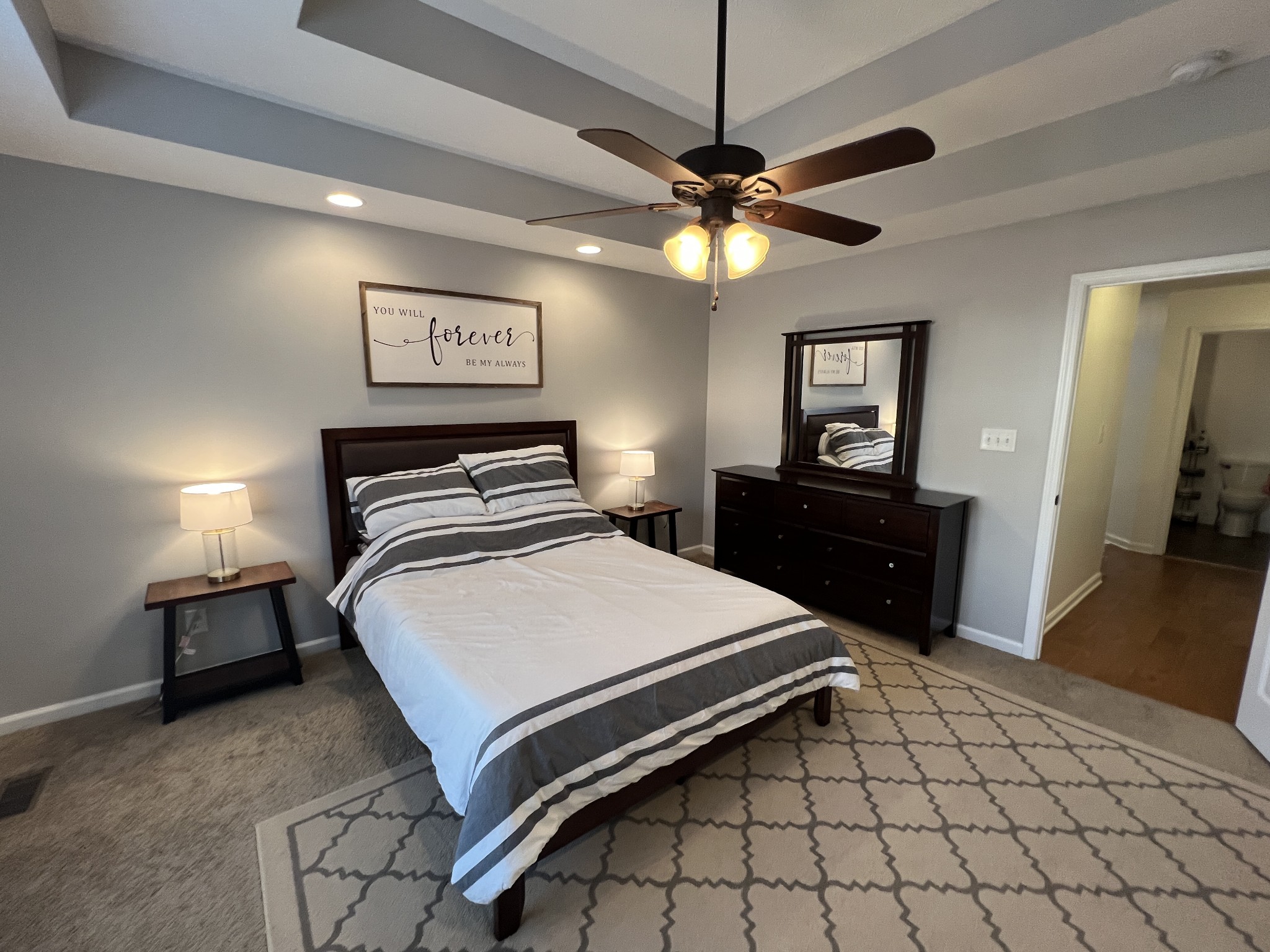 3785 Suiter Road Clarksville, TN 37040 - Photo 9 of 21 a bedroom with a bed and a chandelier