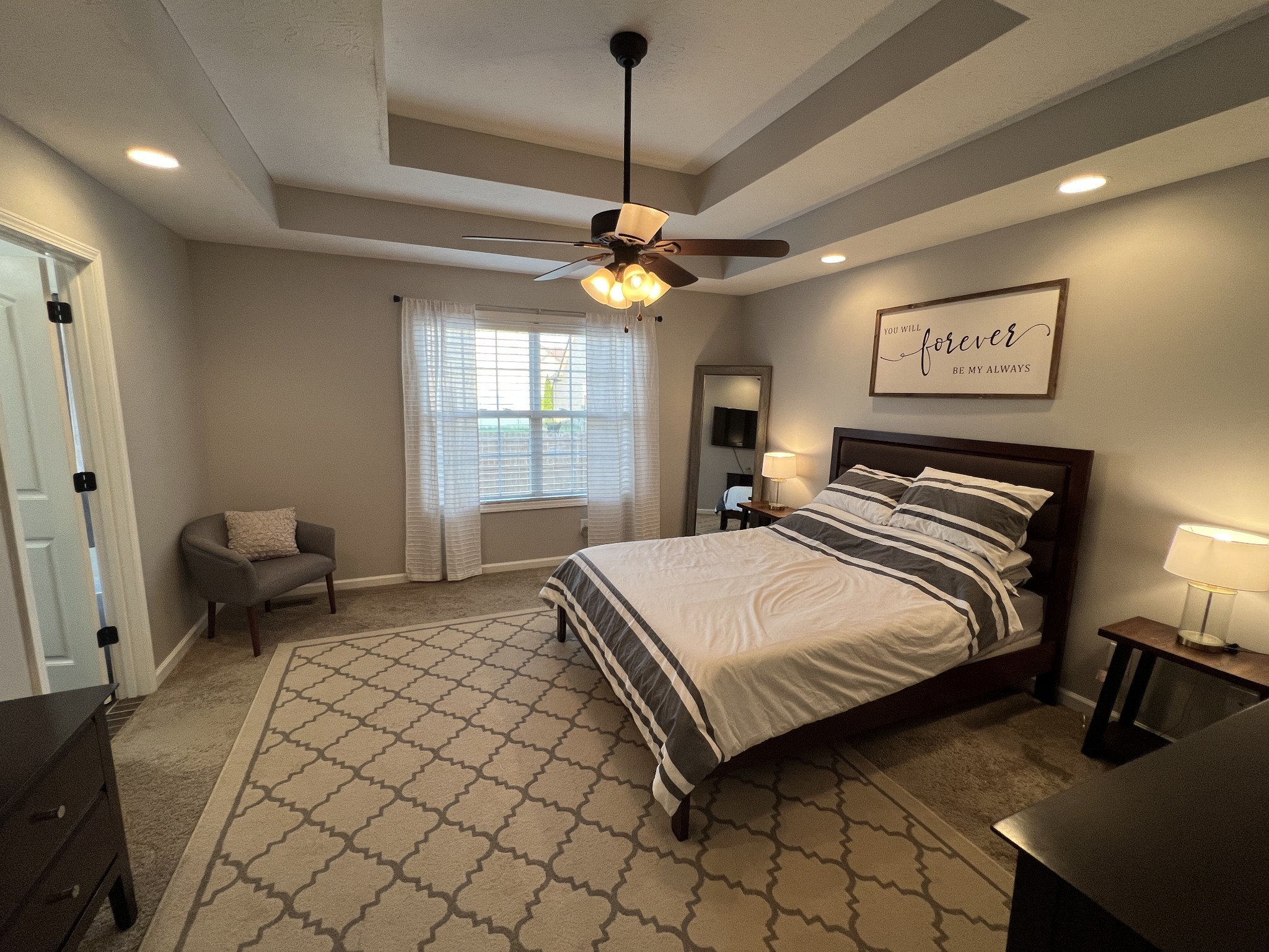 3785 Suiter Road Clarksville, TN 37040 - Photo 10 of 21 a bedroom with a bed and a chandelier
