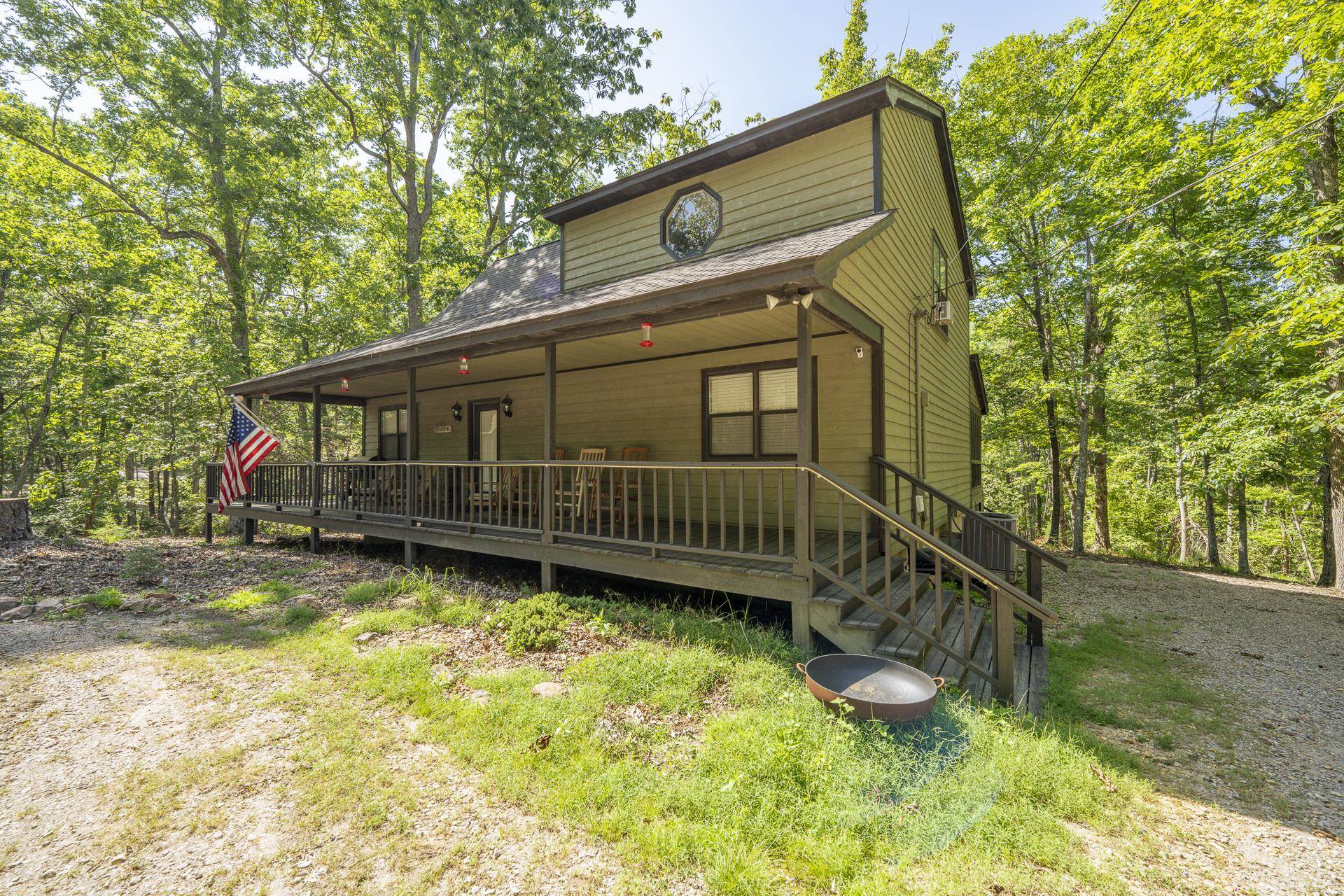 435 Murray Lane Counce, TN 38326 - Photo 3 of 34 Cabin-style residence featuring a wrap-around porch and elevated entry with stairs