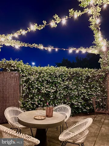 a view of a chairs and a table in the patio