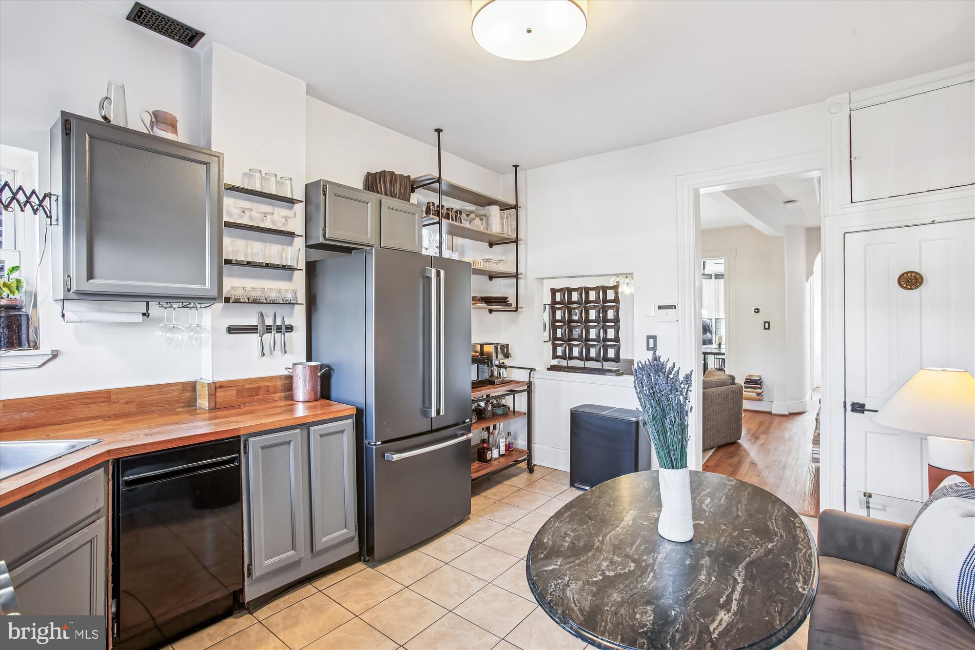 309 Elm Street Northwest Washington, DC 20001 - Photo 28 of 106 a kitchen with stainless steel appliances kitchen island granite countertop a refrigerator a oven a sink and dishwasher