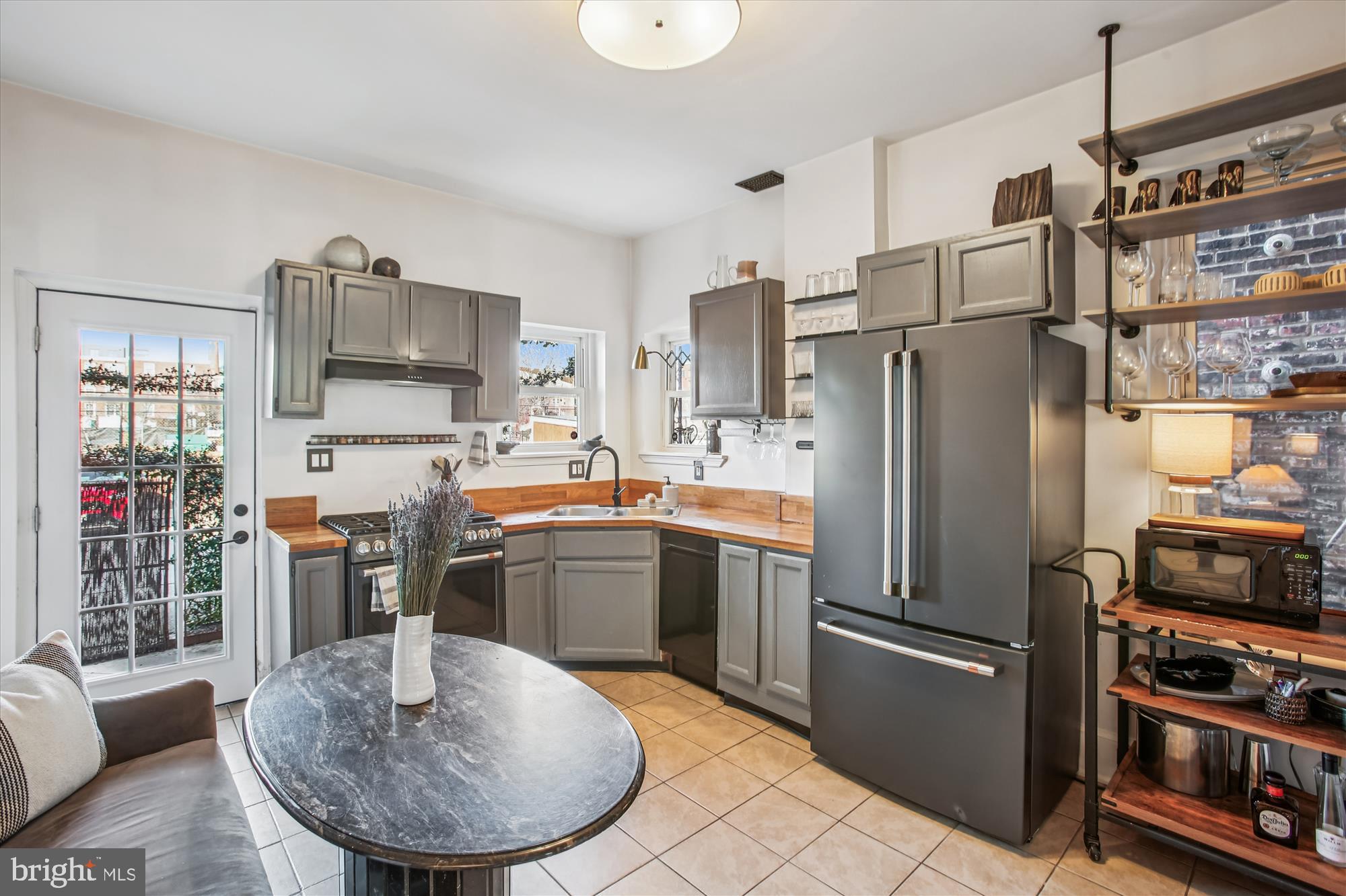 309 Elm Street Northwest Washington, DC 20001 - Photo 29 of 106 a kitchen with stainless steel appliances granite countertop a refrigerator stove top oven a sink and dishwasher
