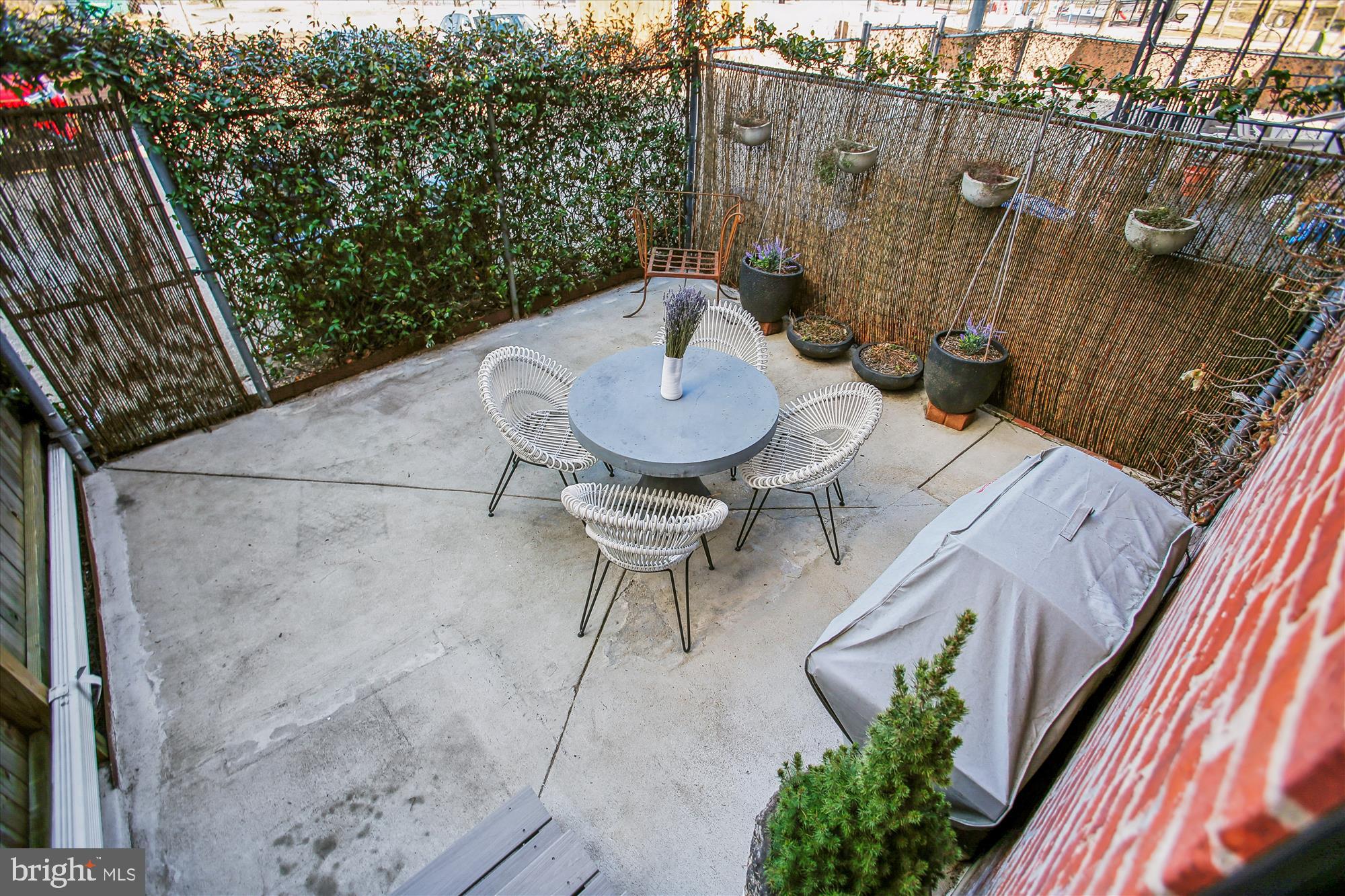 309 Elm Street Northwest Washington, DC 20001 - Photo 39 of 106 a backyard of a house with table and chairs