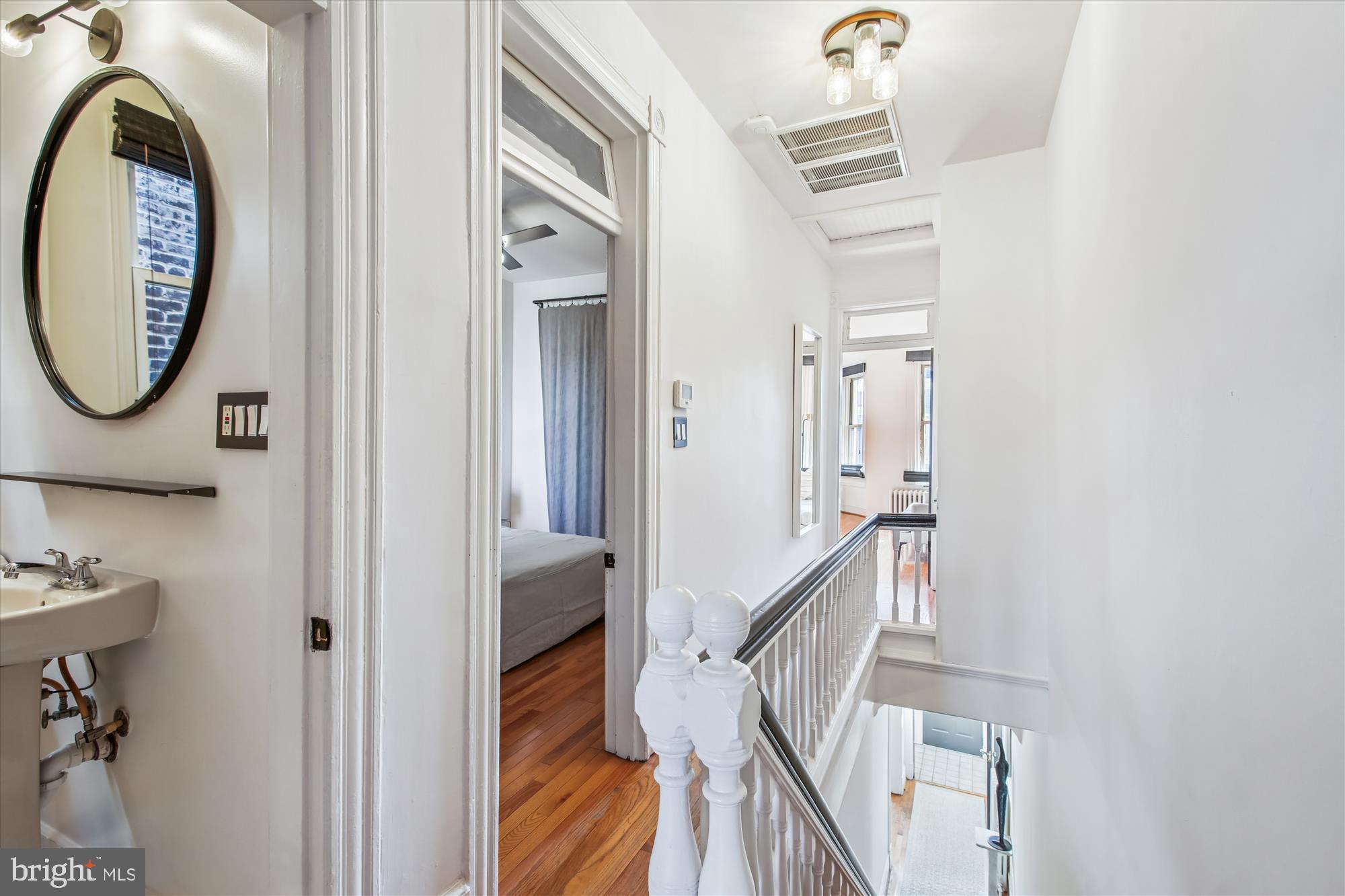309 Elm Street Northwest Washington, DC 20001 - Photo 46 of 106 a view of a hallway with wooden floor and staircase