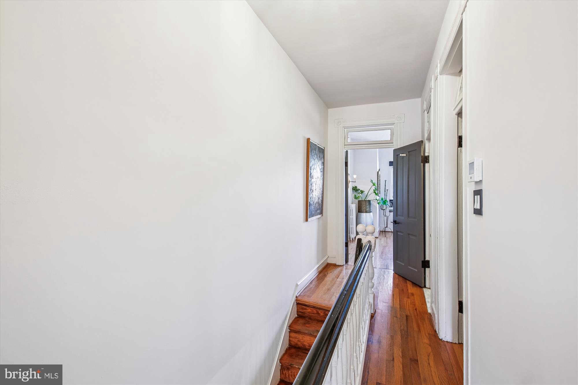 309 Elm Street Northwest Washington, DC 20001 - Photo 53 of 106 a view of a hallway with wooden floor and staircase