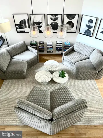 a living room with furniture and white walls
