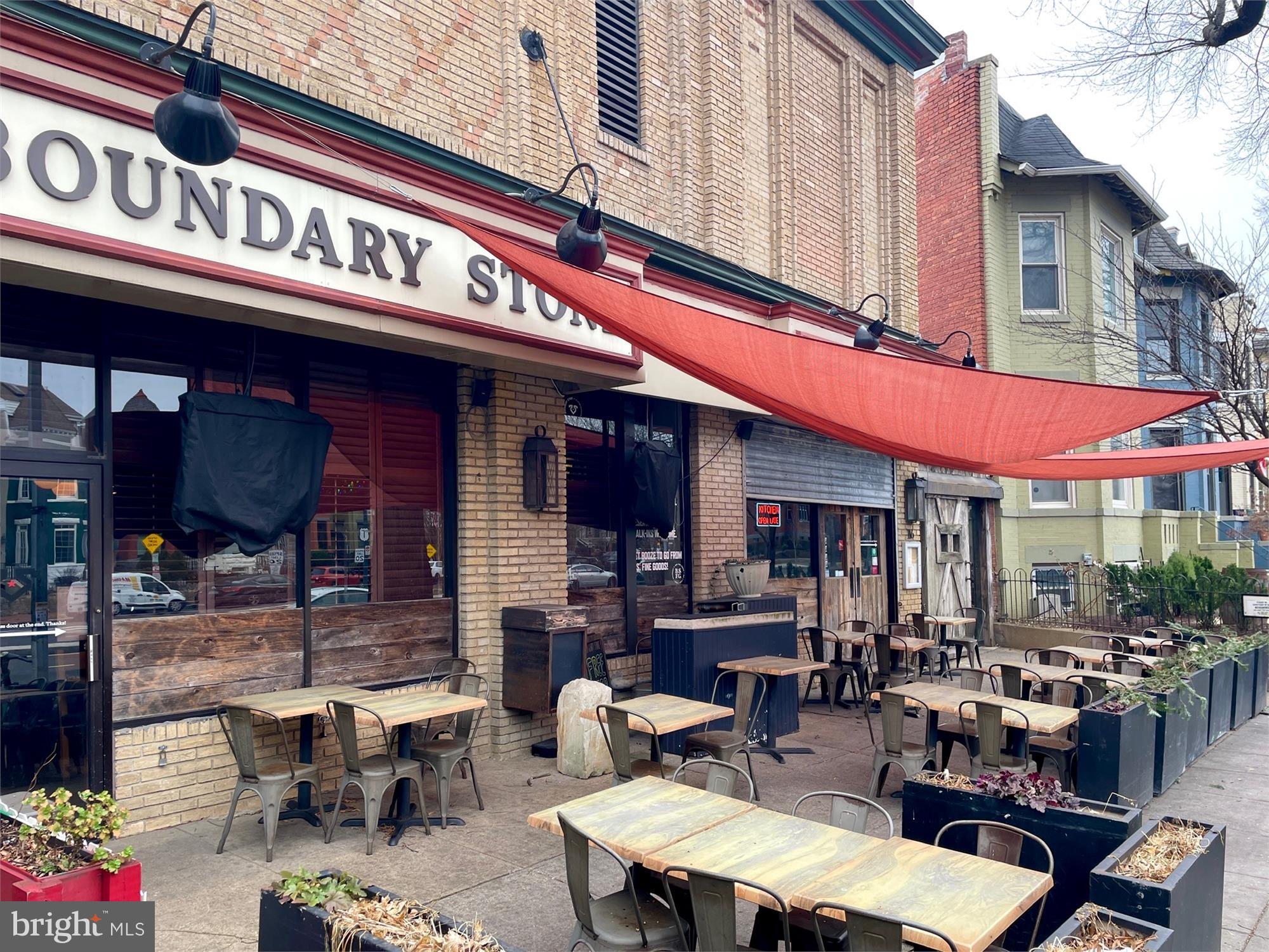 309 Elm Street Northwest Washington, DC 20001 - Photo 86 of 106 a view of a cafe with a table and chairs in front of it