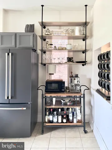 a kitchen with stainless steel appliances granite countertop a stove and a refrigerator