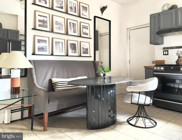 a kitchen with a table and chairs