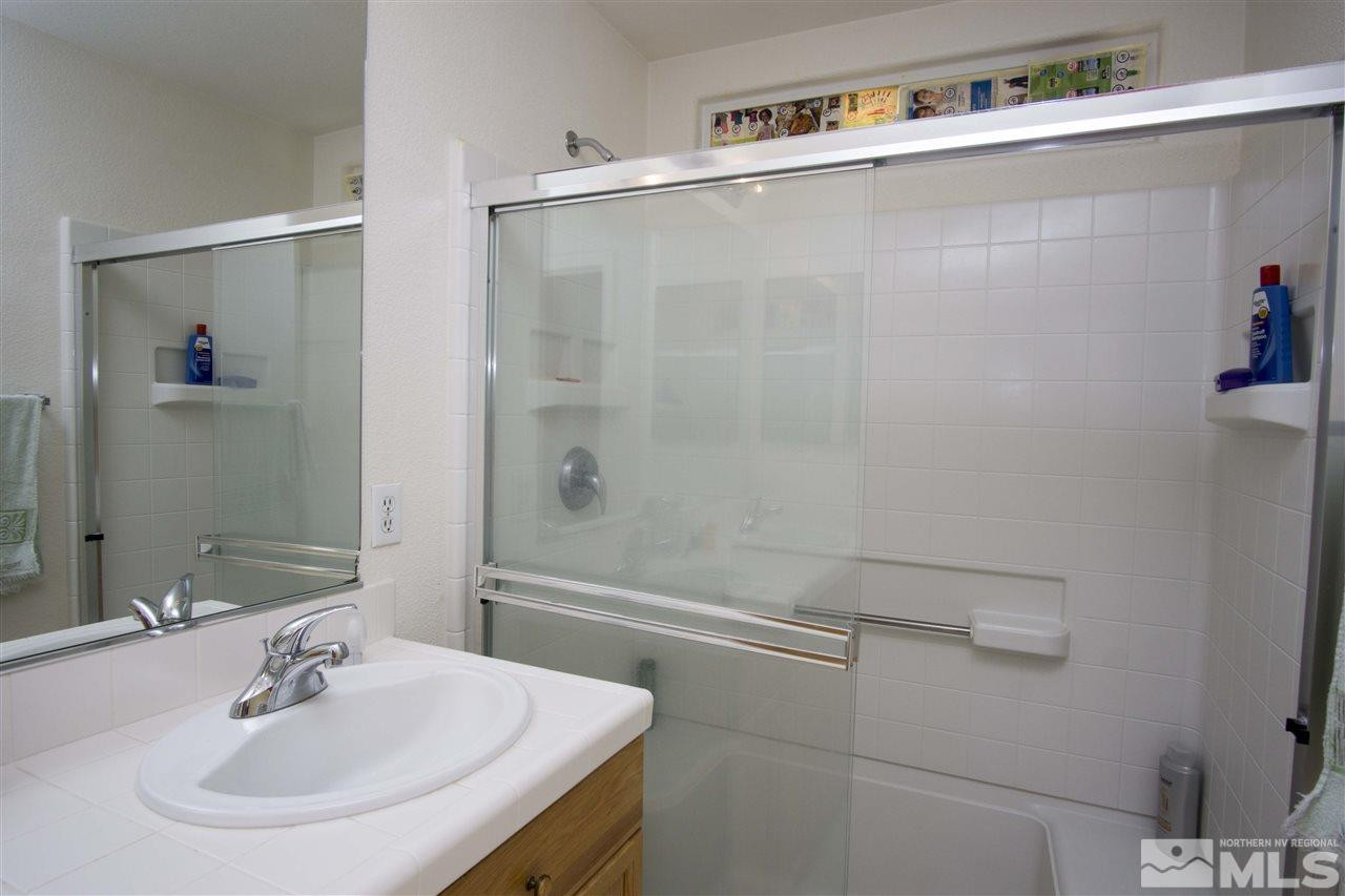9428 Mammoth Drive Reno, NV 89521 - Photo 11 of 18 a bathroom with a sink and a mirror