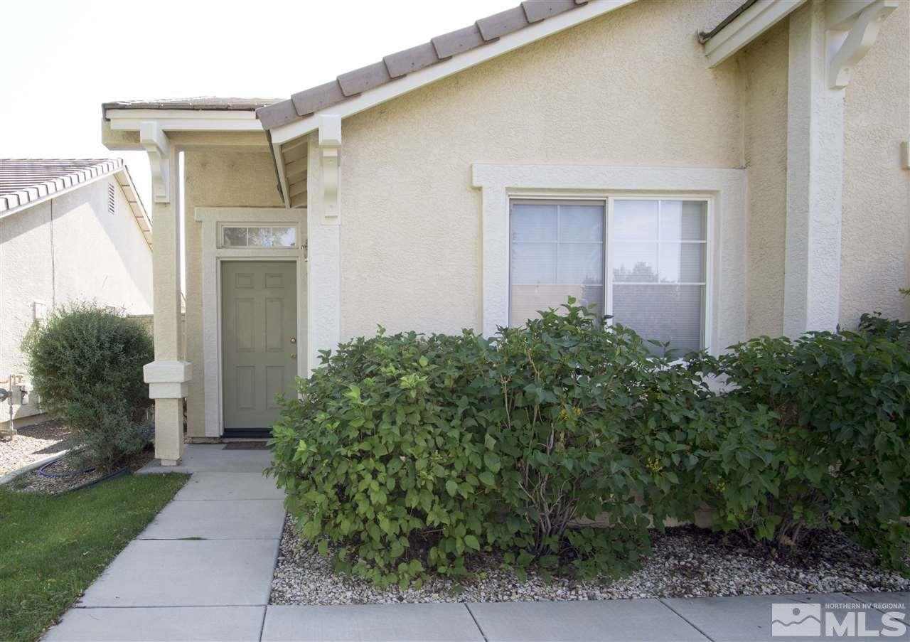 9428 Mammoth Drive Reno, NV 89521 - Photo 2 of 18 front view of a house with a yard