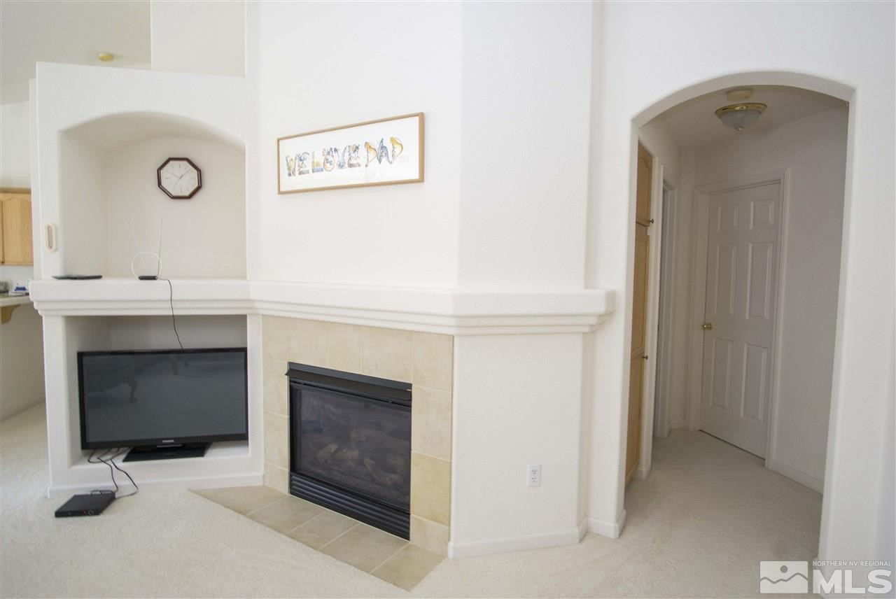 9428 Mammoth Drive Reno, NV 89521 - Photo 5 of 18 a view of an empty room with a fireplace