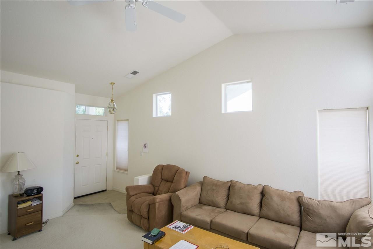 9428 Mammoth Drive Reno, NV 89521 - Photo 6 of 18 a living room with furniture a couch and a window